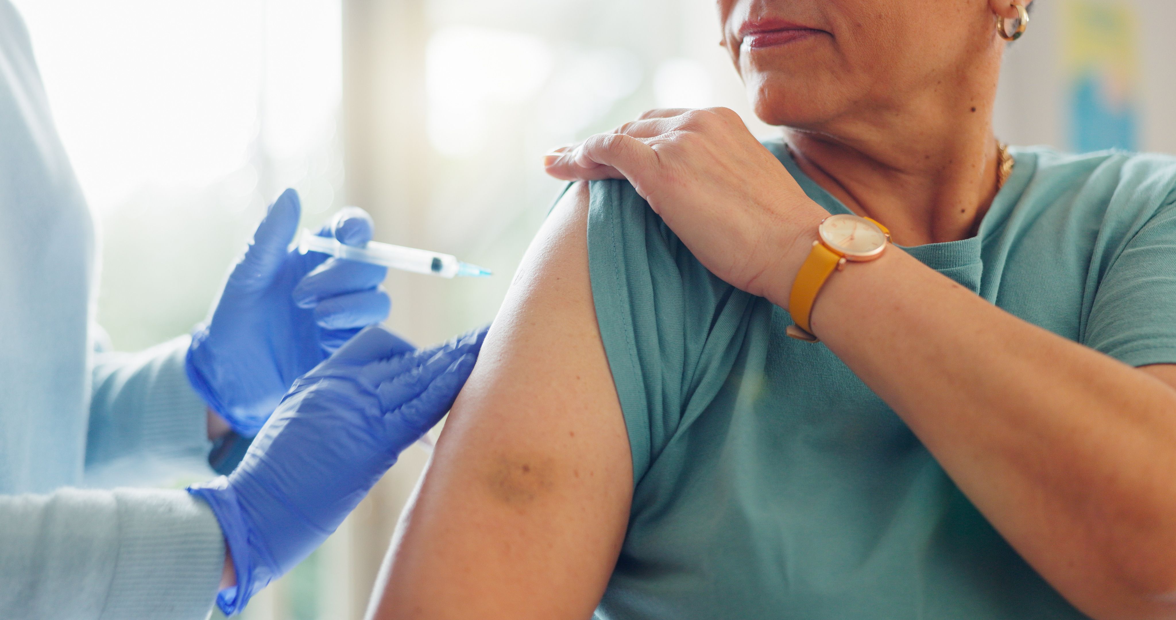needle glove hand doctor with patient injection cure vaccination clinic medical consultation arm person immunization syringe with healthcare worker hospital