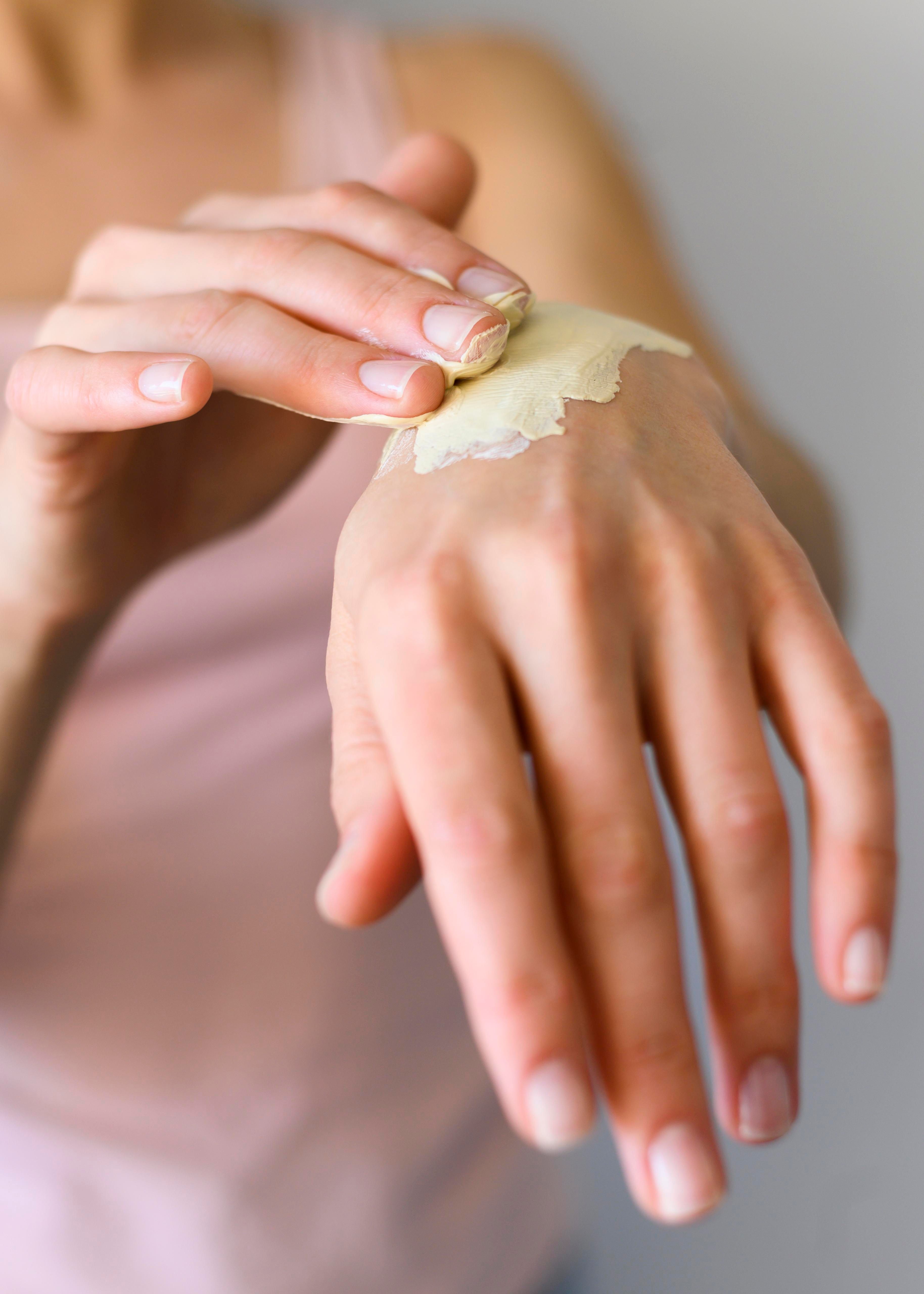 woman-applying-lotion-her-hands.jpg