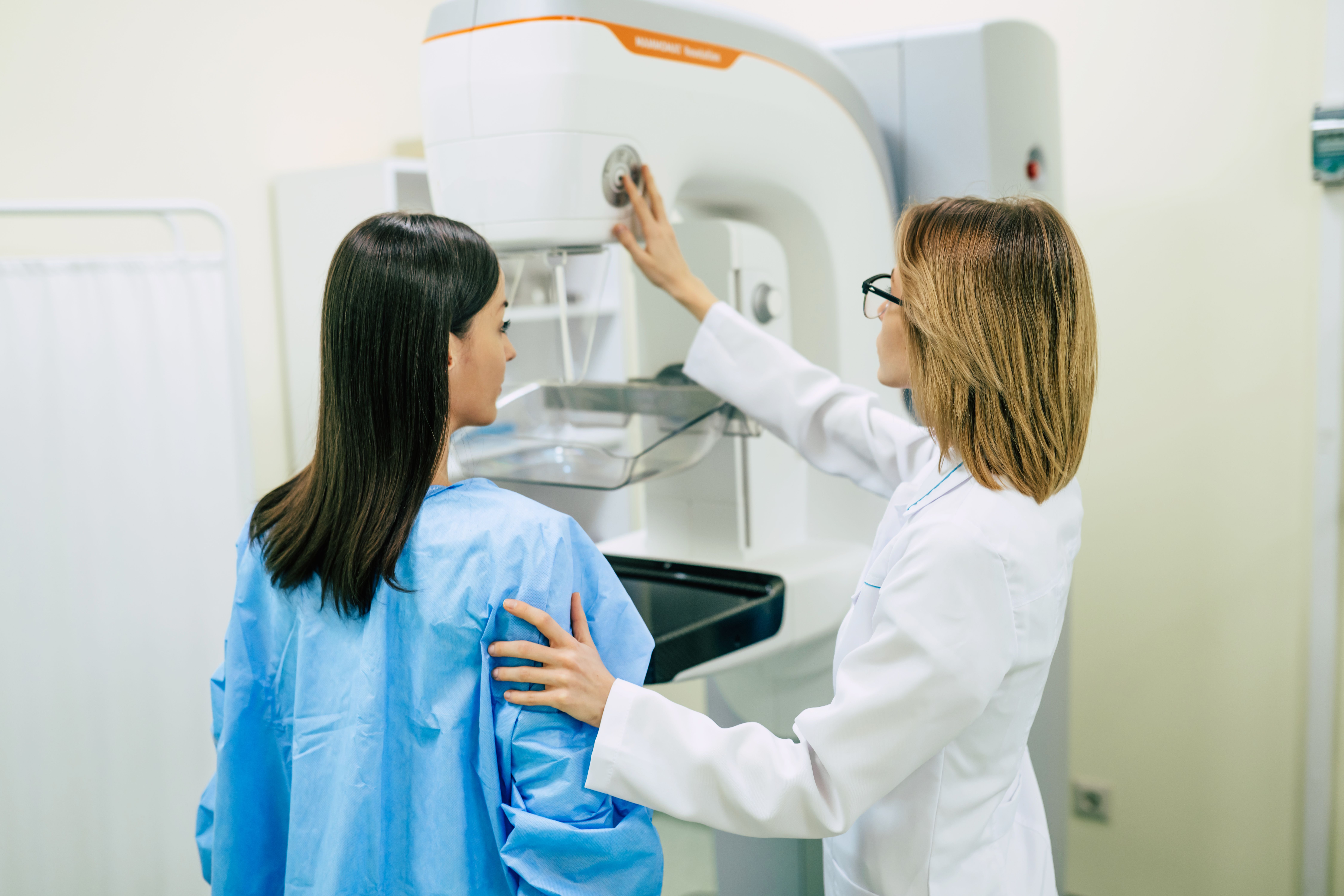 young woman is having mammography examination hospital private clinic with professional female doctor